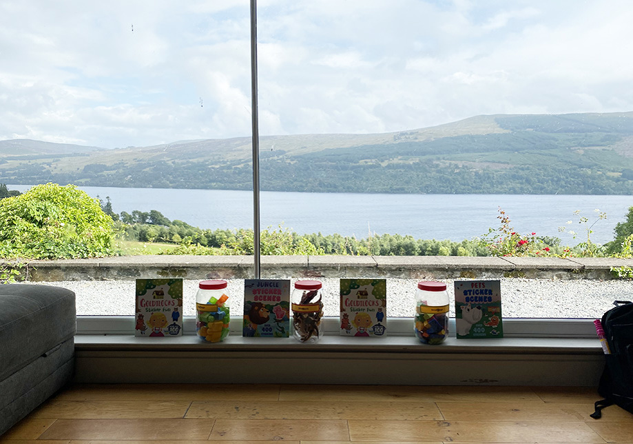 Children's activities on windowsill with sea in background